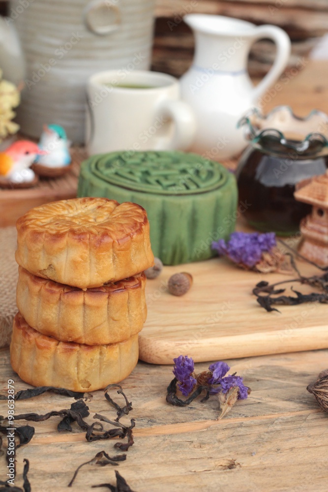 Festival moon cake - china dessert with green tea. Festival moon cake - china dessert with green tea.