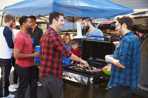 Photography Group Of Sports Fans Tailgating In Stadium Car Park