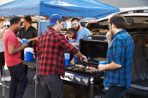 Wall Mural Group Of Sports Fans Tailgating In Stadium Car Park