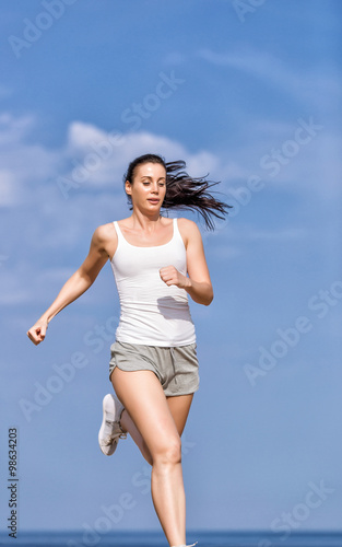Girl runs along seashore © azazello