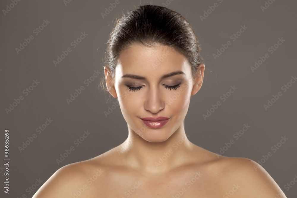 portrait of a young woman with her eyes closed portrait of a young woman with her eyes closed