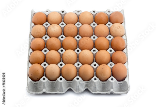eggs in paper rack on white background