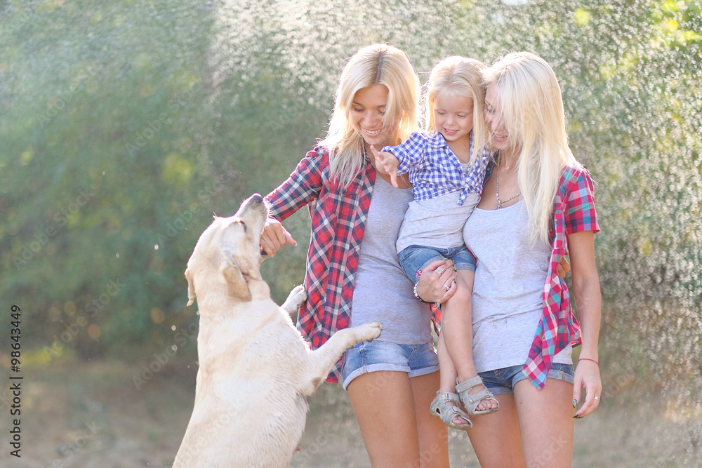 portrait of a happy family in the summer on the nature portrait of a happy family in the summer on the nature