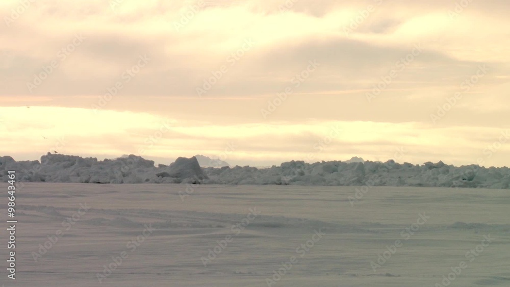 Snowy Arctic landscape at sunset. Snowy Arctic landscape at sunset.