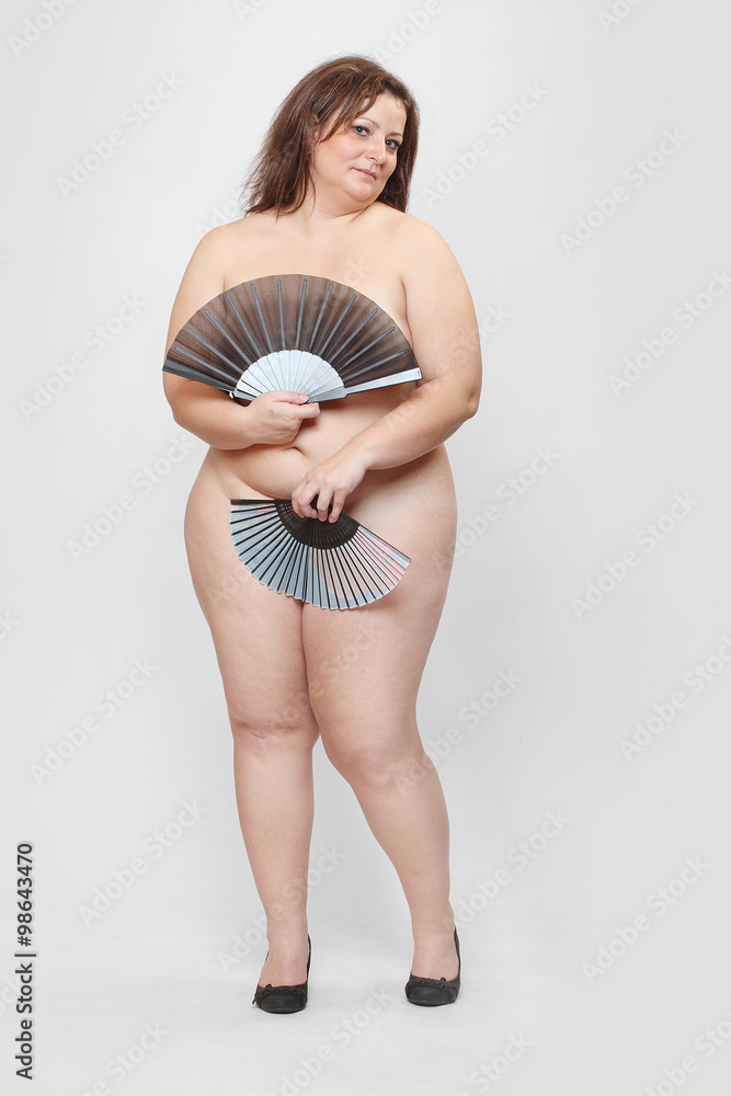 Retro Style Picture Of An Naked Overweight Woman With Folding Fan
