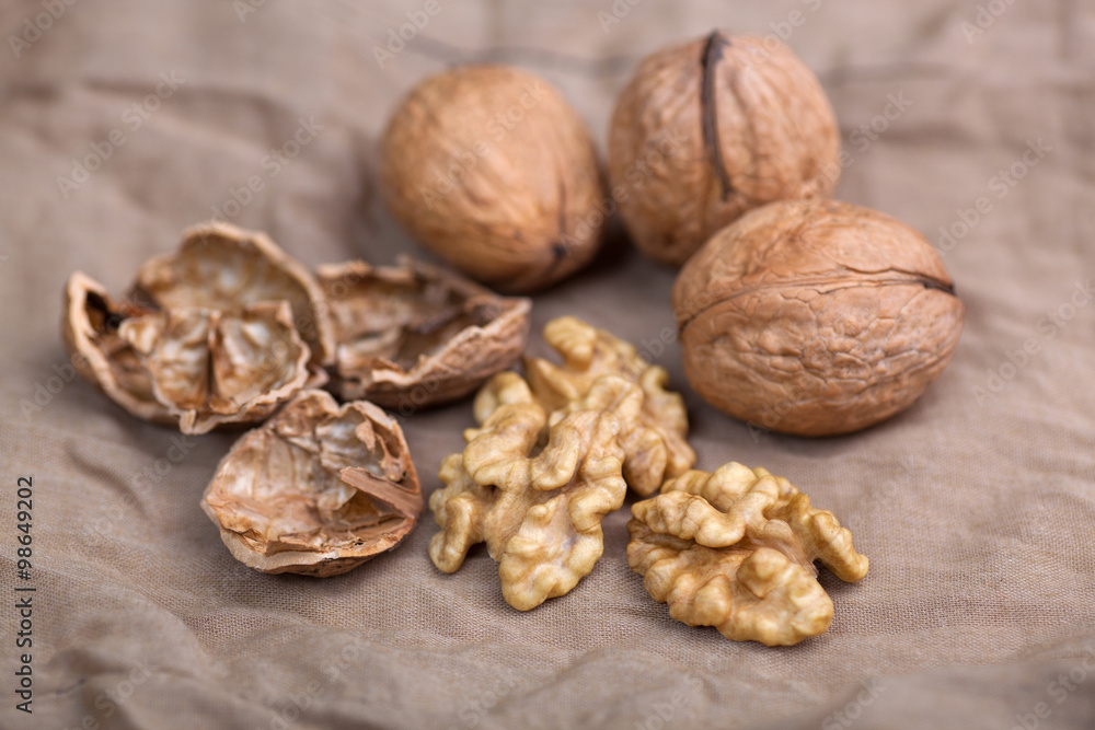 Walnut without shell close-up, and nuts in the shell Walnut without shell close-up, and nuts in the shell