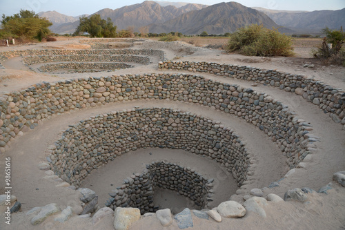 Ancient wells near town Nazca. Peru.
