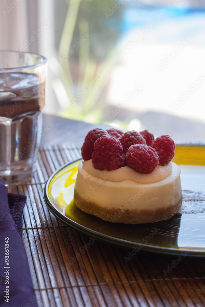 Closeup of an individual raspberry cheesecake Closeup of an individual raspberry cheesecake