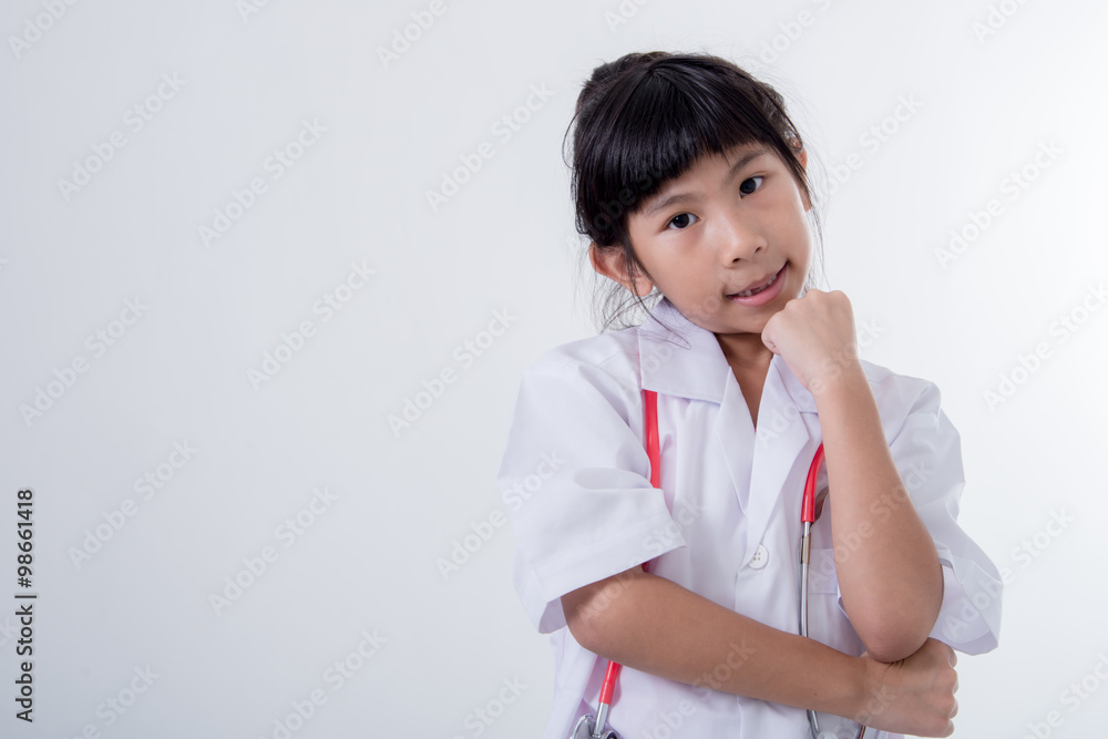 Little girl pretending to be a doctor on white background