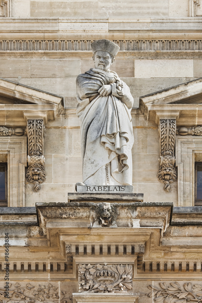 Obraz premium Sculpture of an ancient figure, Louvre Museum, Paris