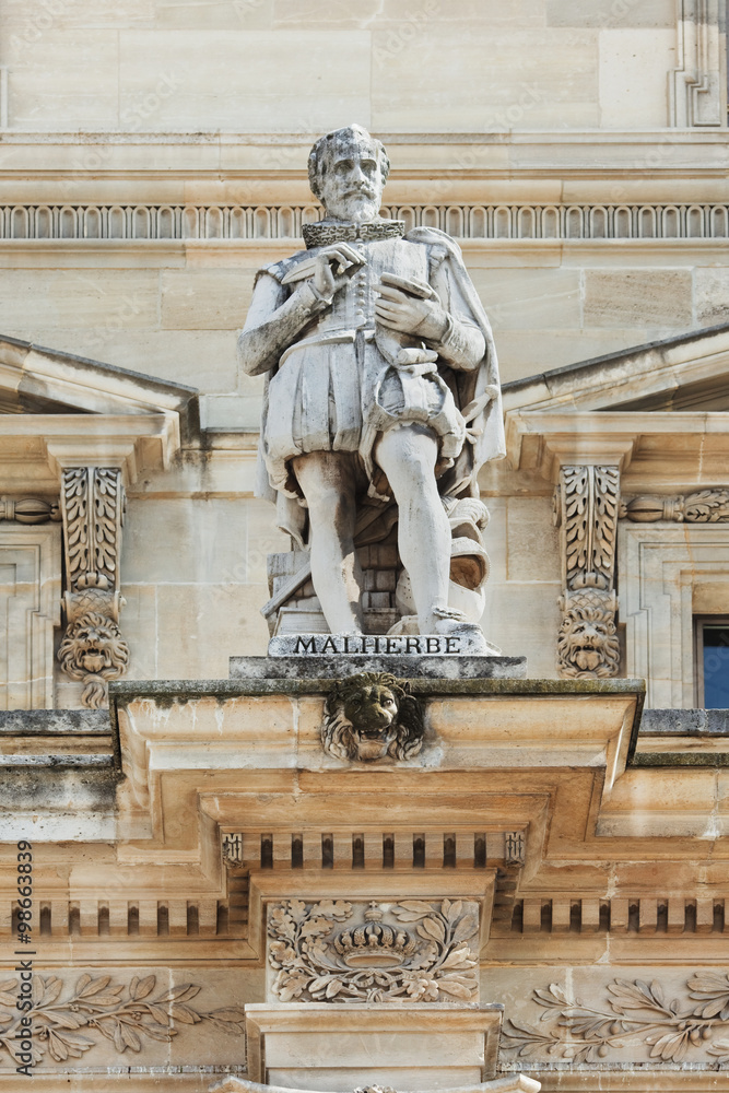 Sculpture of an ancient figure, Louvre Museum, Paris