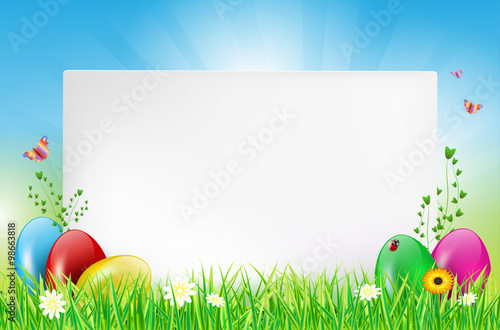 Happy Easter card with copy space and eggs in grass