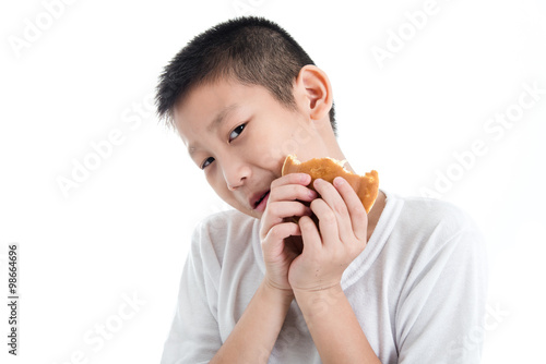 Boy eating dough nut Isolate on white background