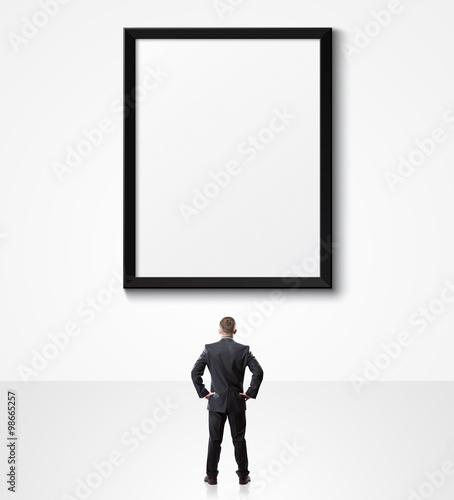 businessman looking up at empty poster © 4Max