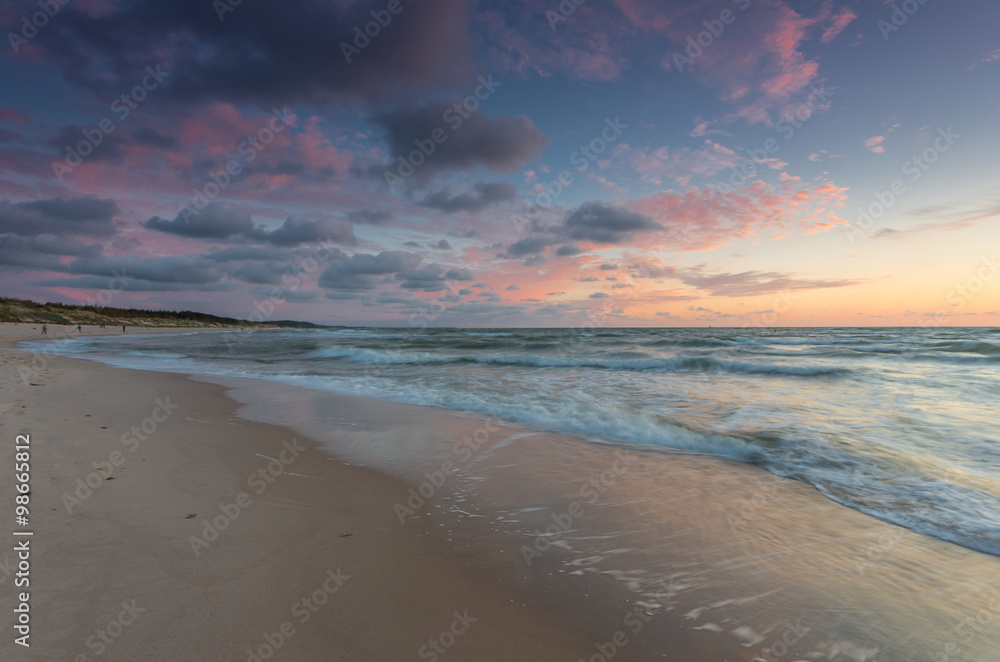 Baltic sea coast at picturesque sunset in Rowy, near Ustka, Poland