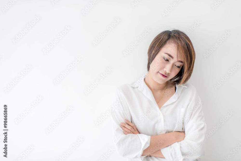 attractive asian woman standing on floor with white wall. attractive asian woman standing on floor with white wall.
