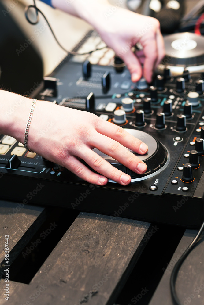 hands on the DJ decks hands on the DJ decks