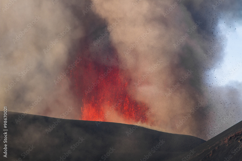 Volcano eruption. Mount Etna erupting from the crater Voragine
