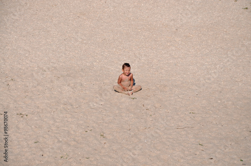 lonely boy in the sand