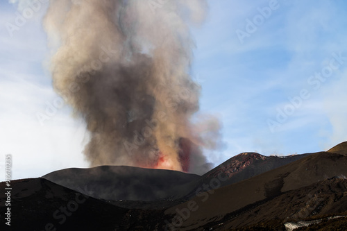 Volcano eruption. Mount Etna erupting from the crater Voragine 