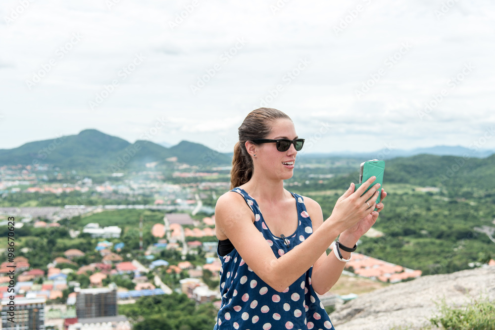 Young woman selfie on the beautiful nature view in mountains.