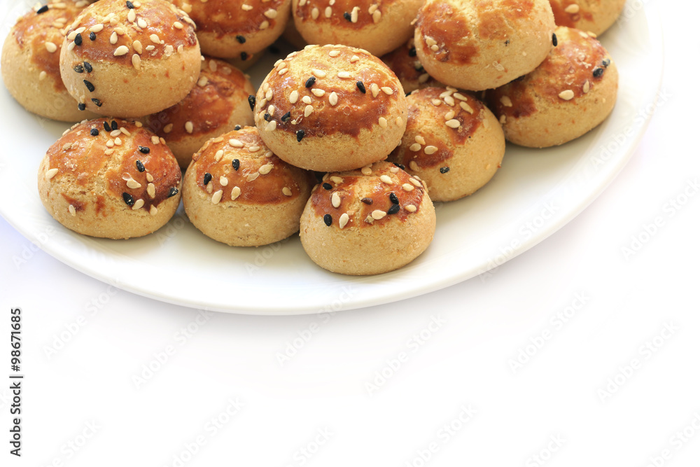 Sesame cookies on the plate . Sesame cookies on the plate .