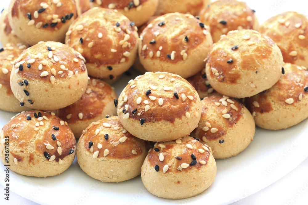 Sesame cookies on the plate . Sesame cookies on the plate .
