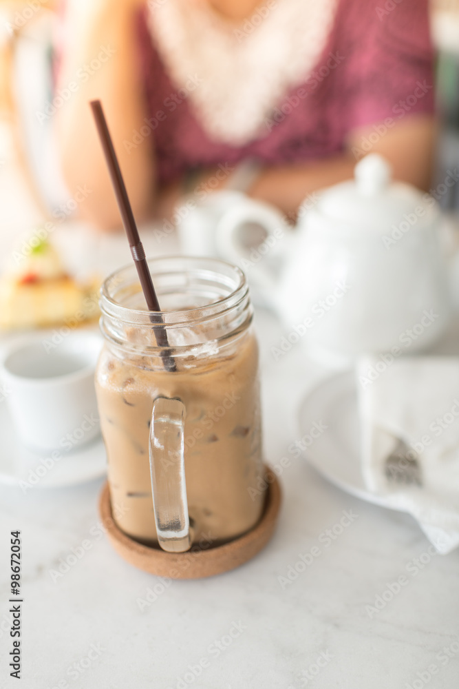 Ice coffee on table with white jar. Ice coffee on table with white jar.