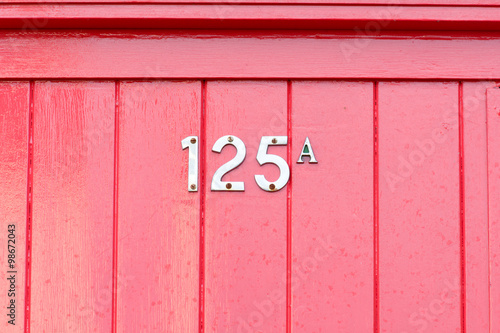House number 125A sign