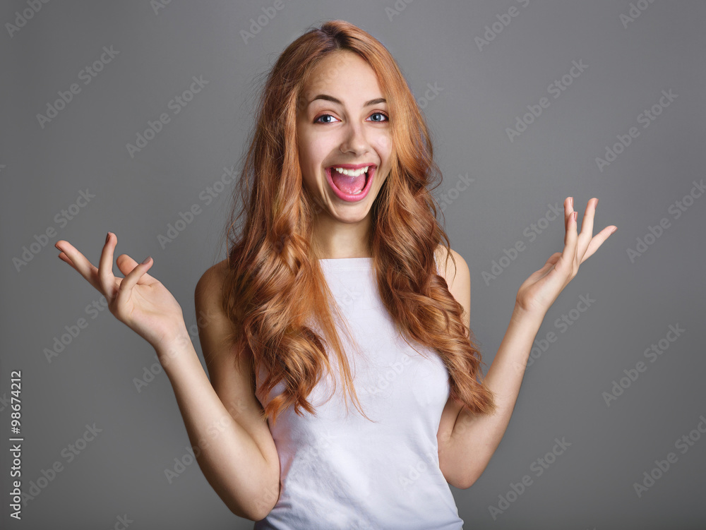 Smiling woman in gesture of asking over gray background. Smiling woman in gesture of asking over gray background.