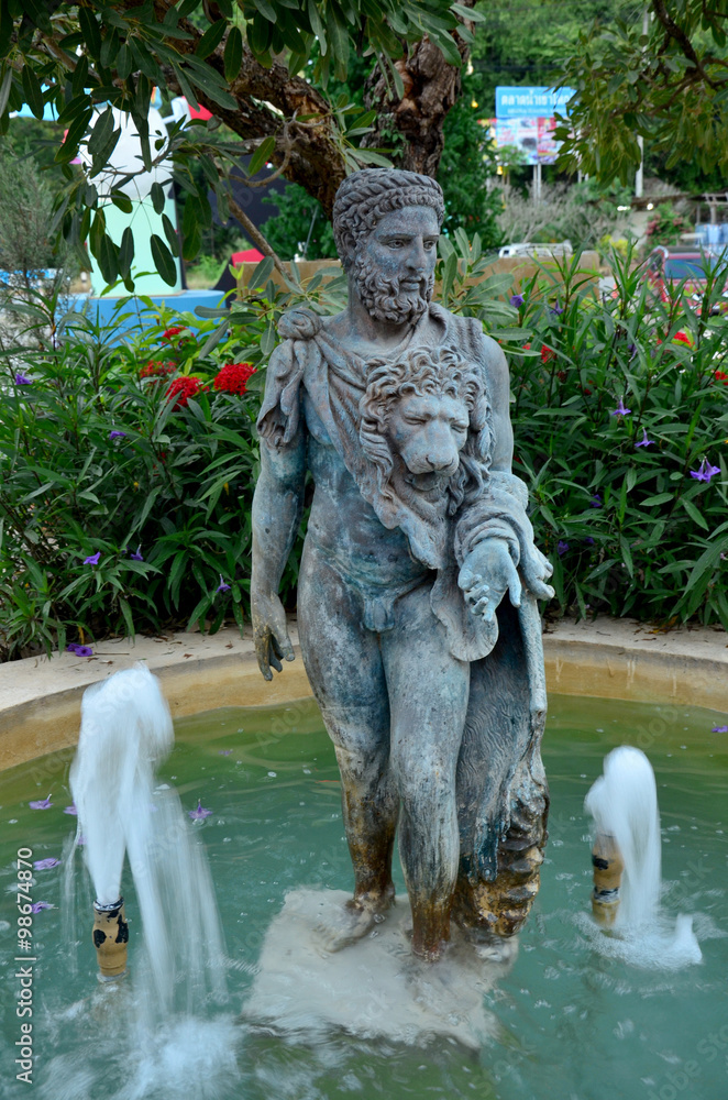 Man and Lion head statue with fountain