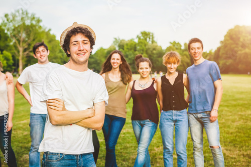Young Man with Group of Friends at the Park