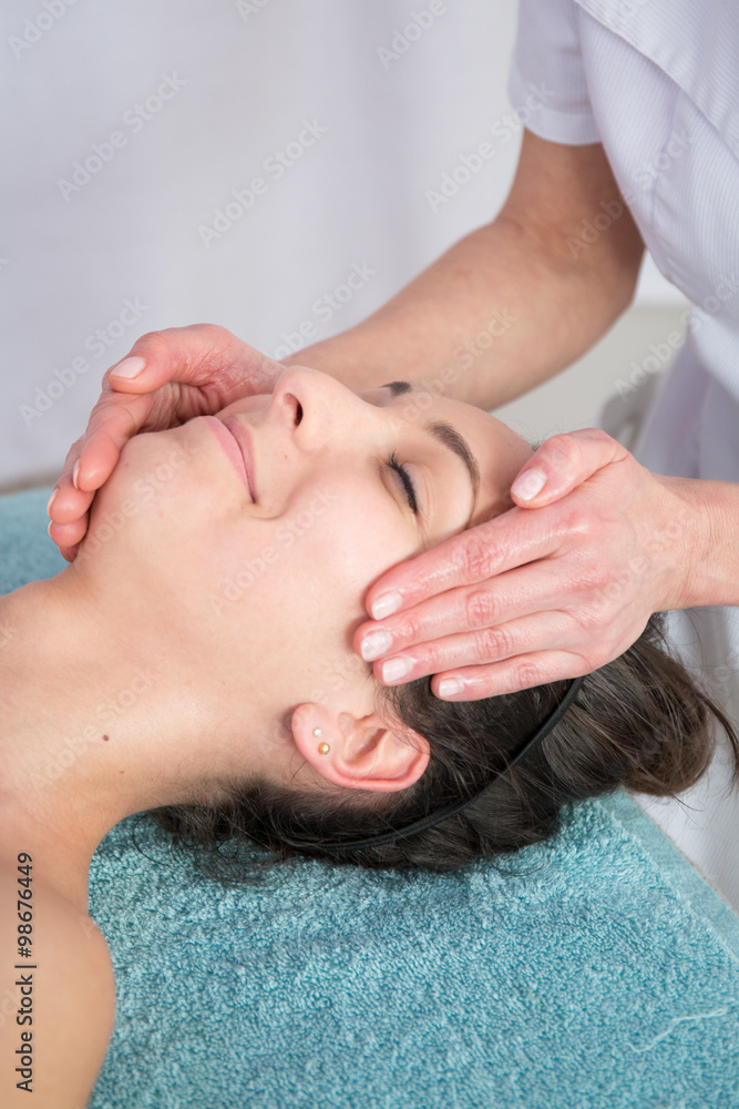 Young attractive woman getting spa treatment over white background Young attractive woman getting spa treatment over white background