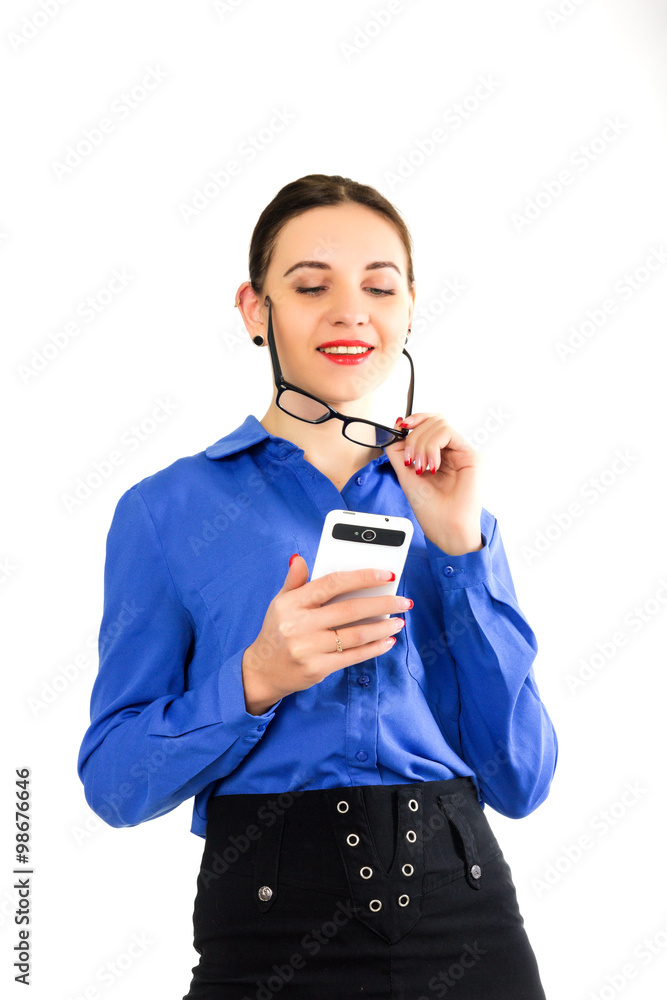 beautiful sexy woman in a business suit stands next to a suitcase and talking on the phone business woman traveling beautiful sexy woman in a business suit stands next to a suitcase and talking on the phone business woman traveling