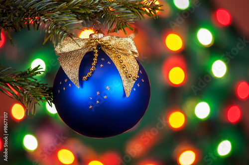 Decorated Christmas tree on blurred, sparkling and fairy backgro