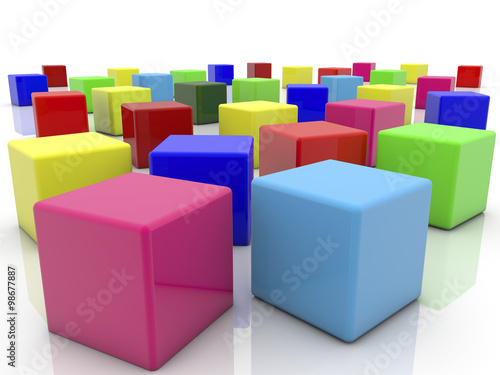 Toy cubes in various colors on white   