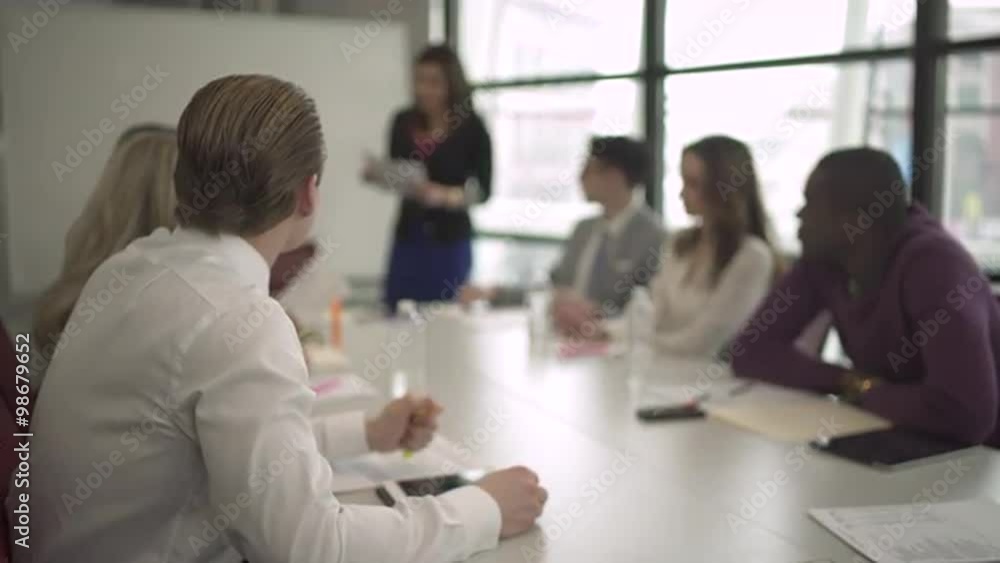 Group of attractive professionals involved in meeting Group of attractive professionals involved in meeting