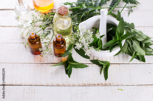 Obraz na plátně Bottles with essential aroma oil with mint