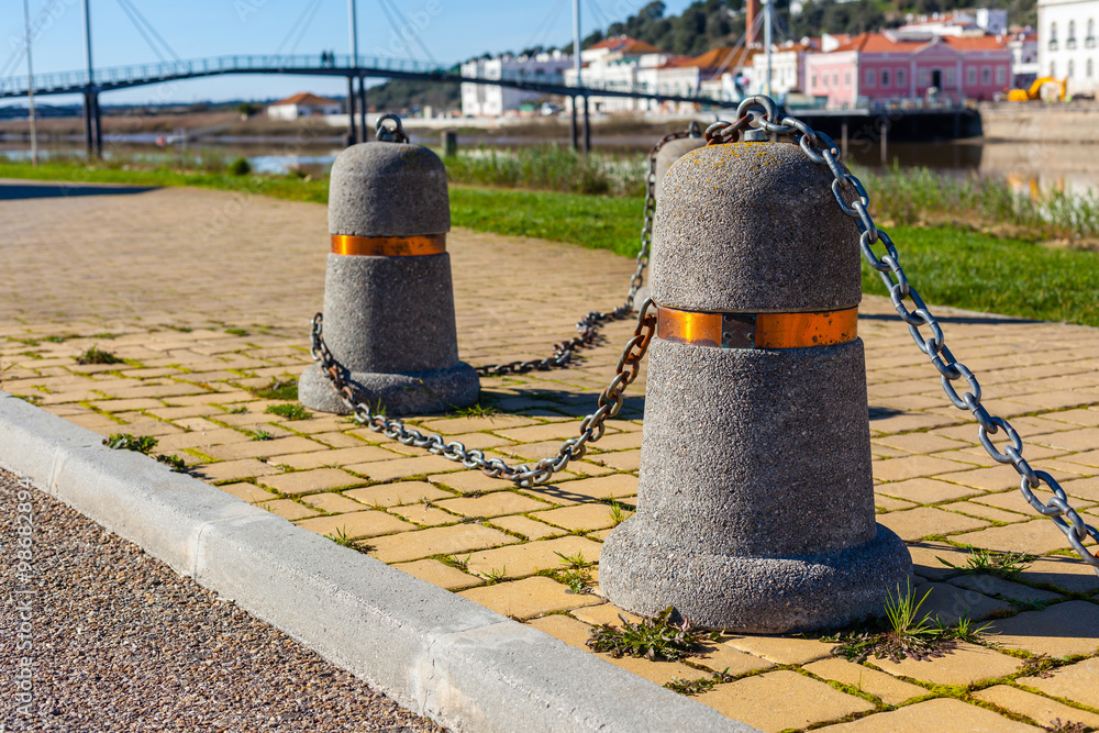 Stub posts linked in a chain on a quay Stub posts linked in a chain on a quay