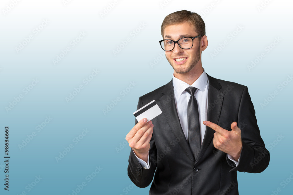 Young happy man holding credit card Young happy man holding credit card
