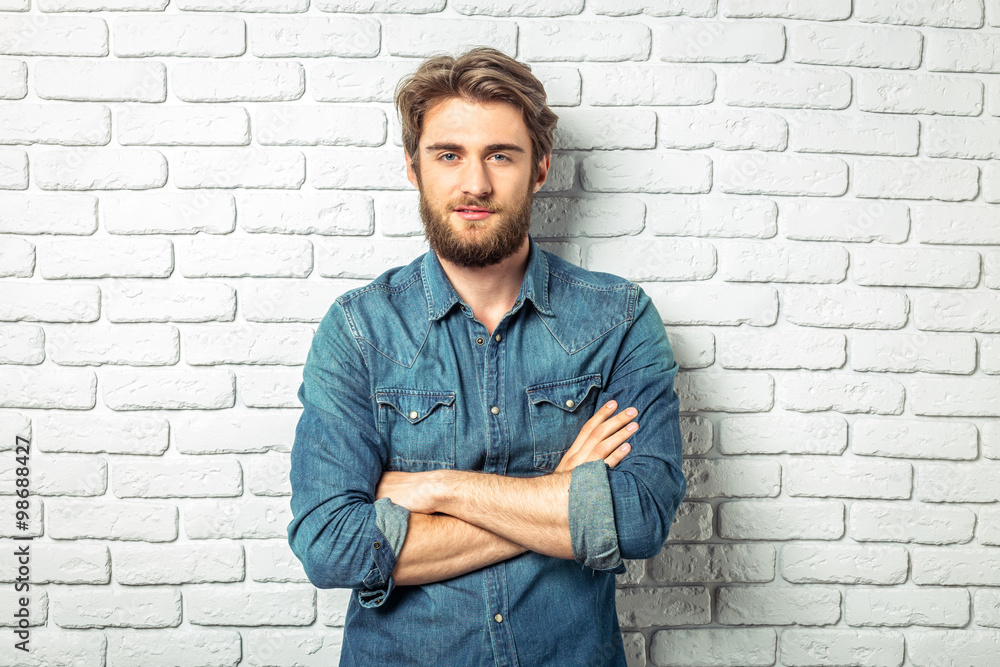 Portrait of a smiling man in a denim shirt Portrait of a smiling man in a denim shirt