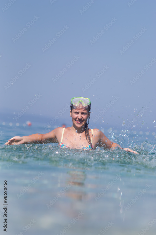 Beautiful young woman enjoying a healthy lifestyle at the sea