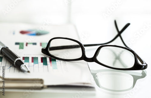 Business chart and eyeglasses