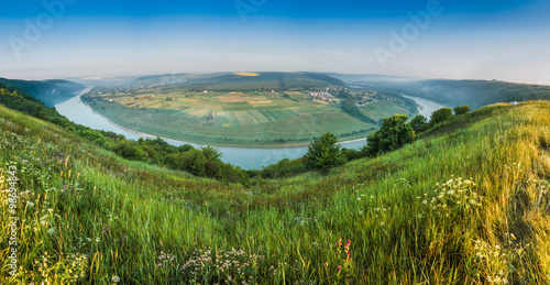 The scenic summer landscape, bend of the river, the panoramic view from the hill.