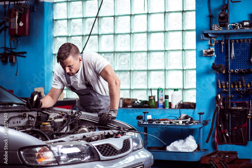 Car mechanic at work photo