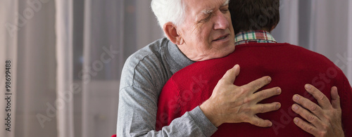 Obraz na plátně Hugging helpful caregiver