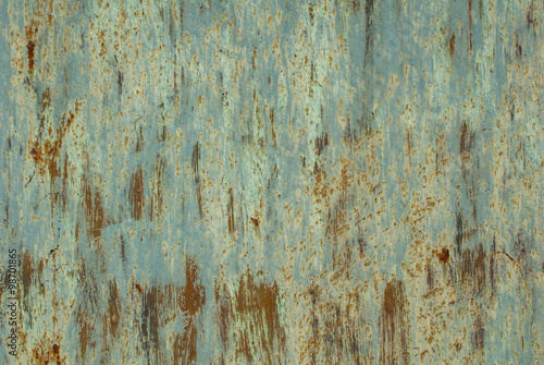 old surface of the metal sheet covered with old paint texture background