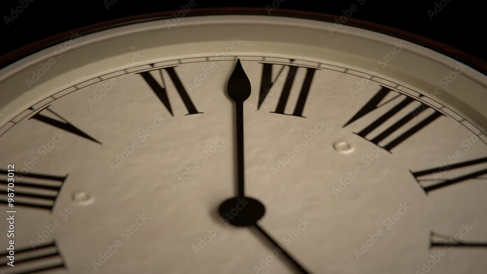 Close up on a clock The decorative hands are moving fast, speeding time.