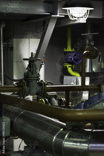 abstract interior of the plant: pipes valves, steel construction