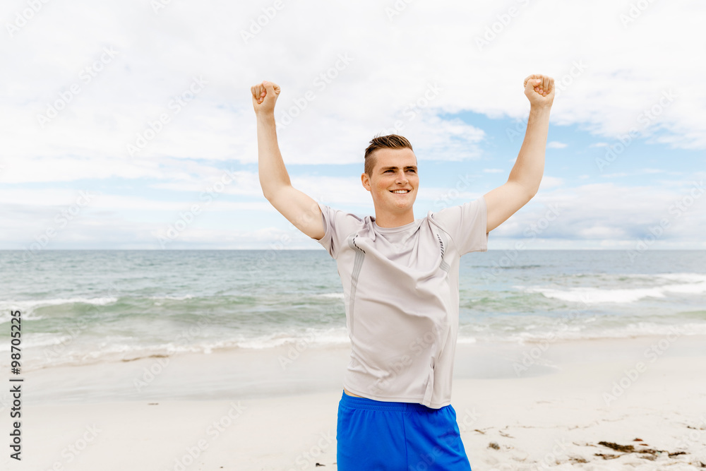 Young man in sport wear with outstretched arms Young man in sport wear with outstretched arms